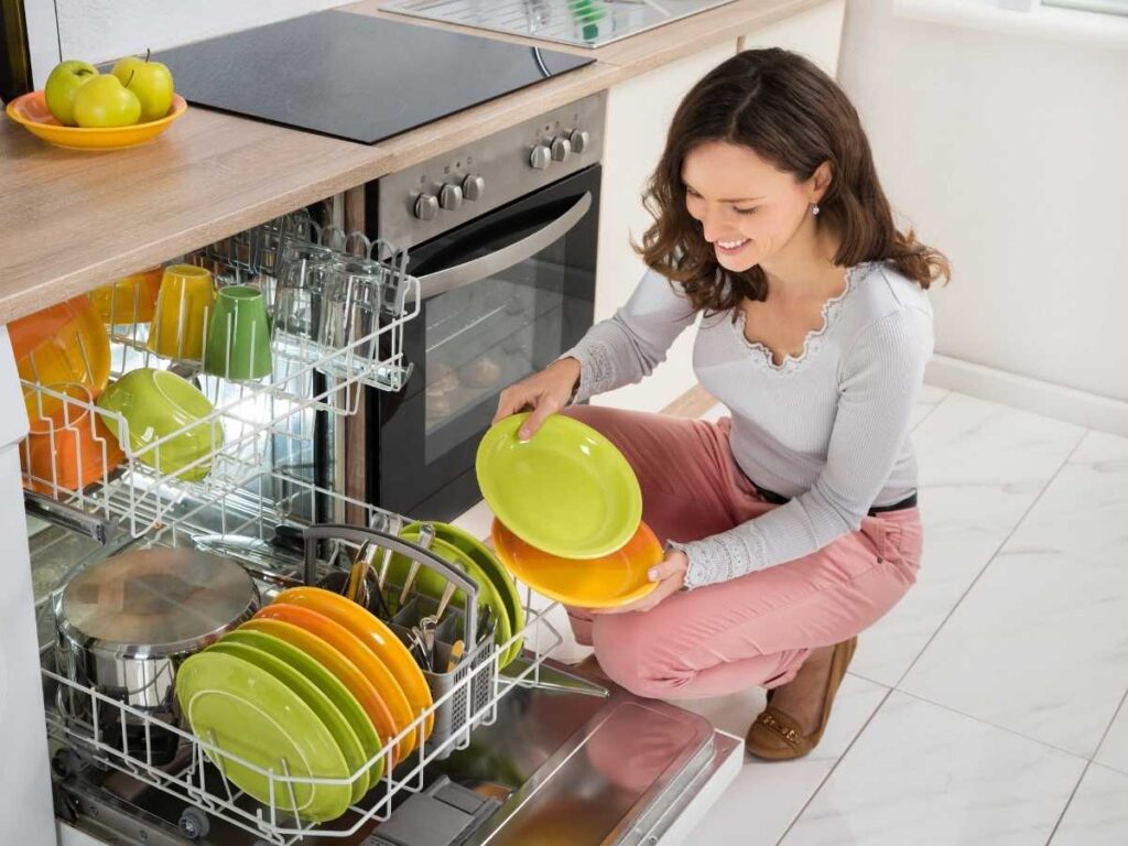 lady emptying dishwasher
