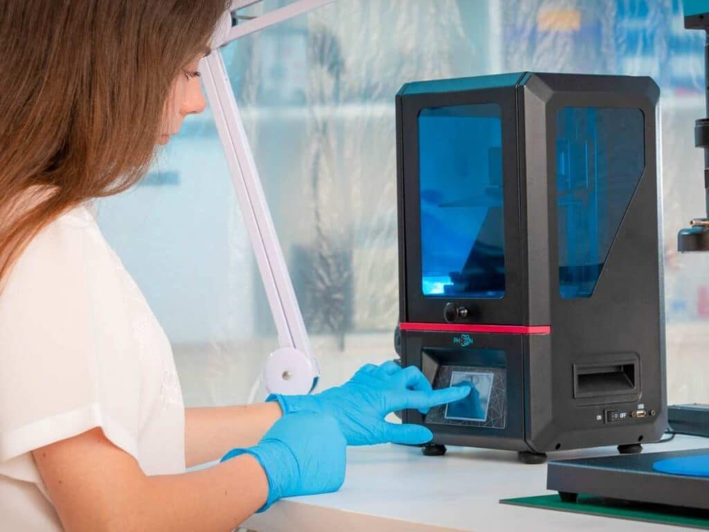 scientist working with 3d resin printer
