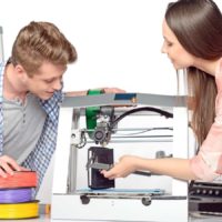 3d printing with man and woman holidng calipers