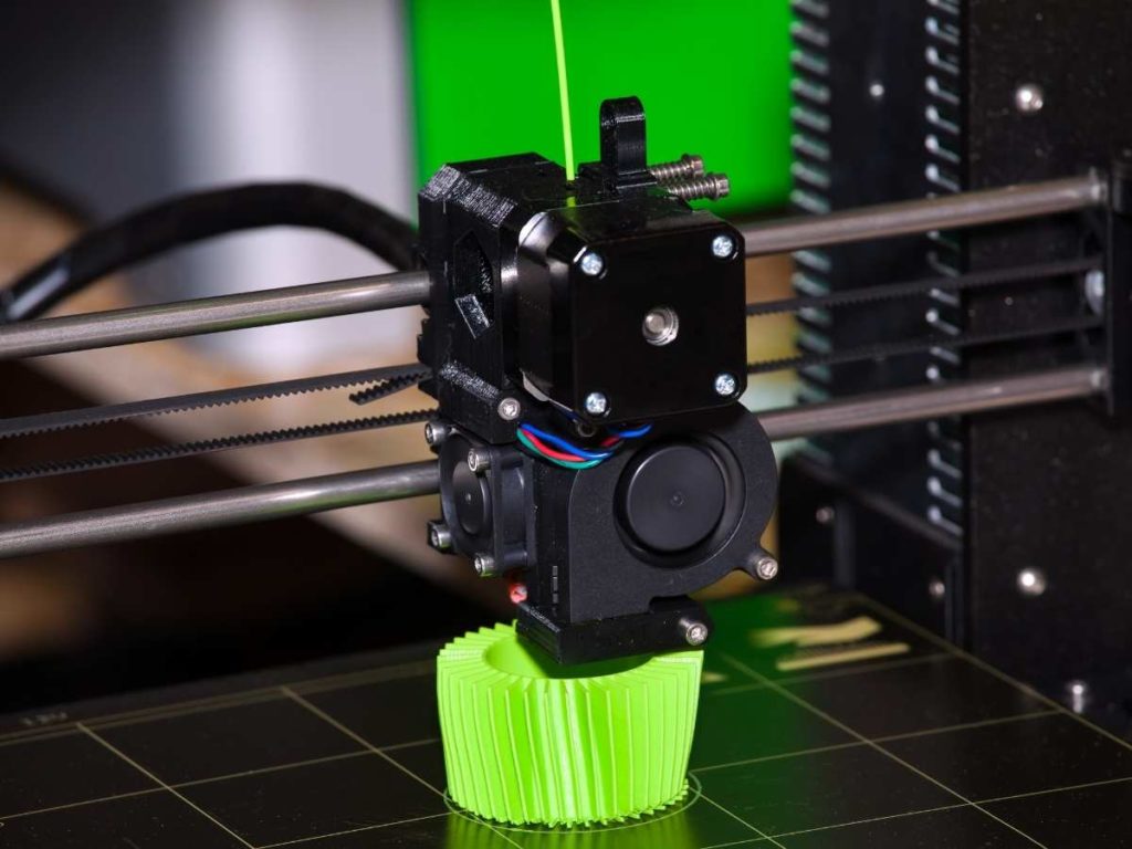 3d printer with a close up of the 3d printer extruder