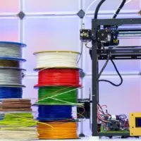 3d printer with a stock of old filament spools