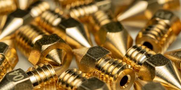 a big pile of brass nozzles