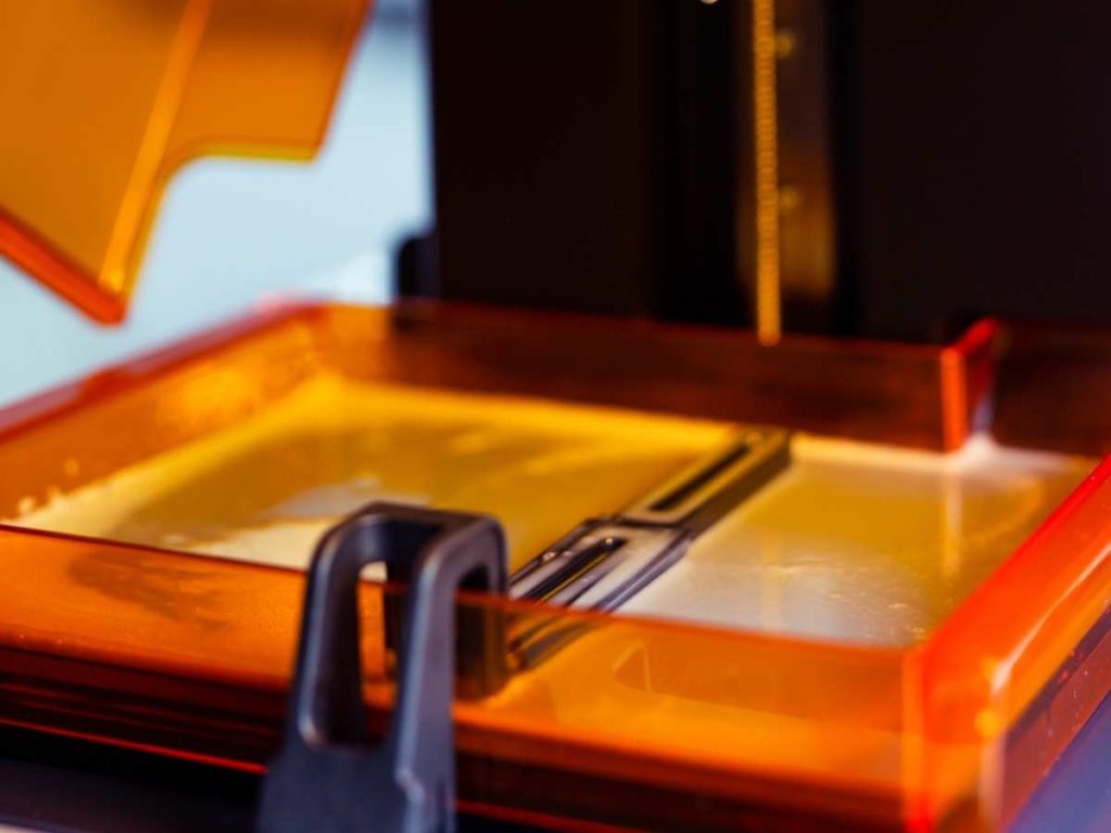 resin 3d printer with a full resin vat preparing to store
