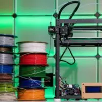 3d printer with a stack of different type of filament spools