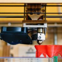 3d printing an red object which is half finished