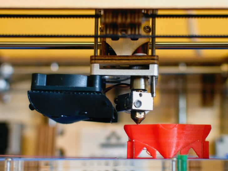 3d printing an red object which is half finished