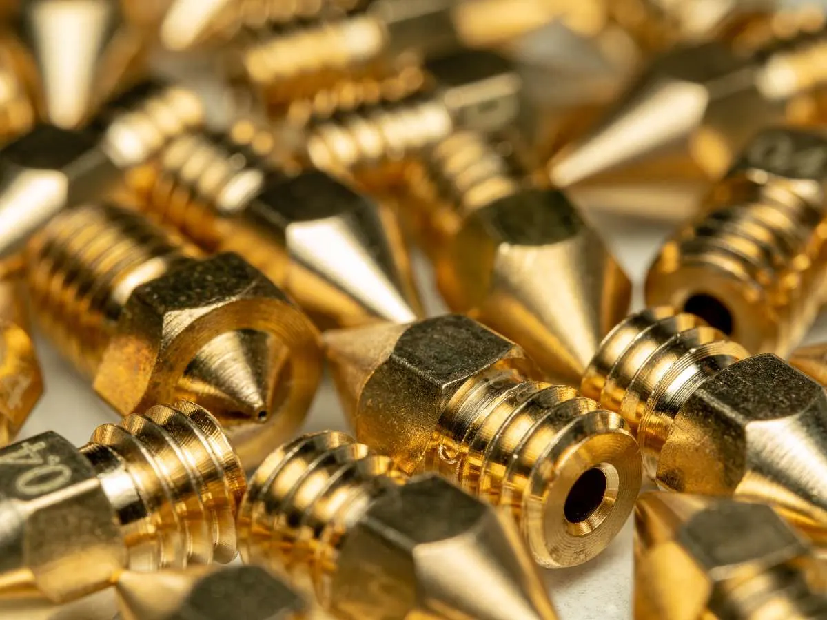 table full of 3d printer brass nozzles