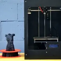 3d printer with wooden table support and 3d printed object